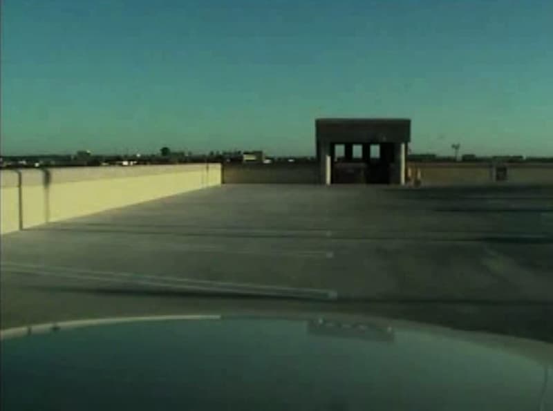 The Status of the Shooter (video still,) 4 channel video, audio, books, vitrine. 2013