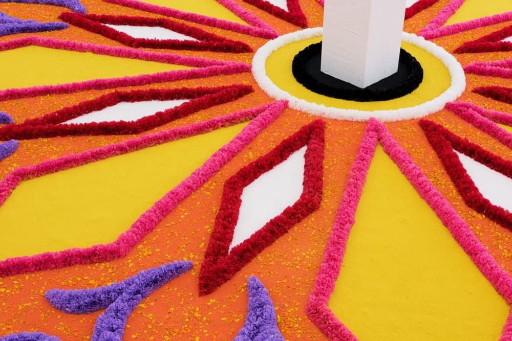 Detail: The Offering (Tapete de Flores), 2016 . Artificial flowers, natural flowers, dyed sawdust, salt, glue . 8 meters in diameter.