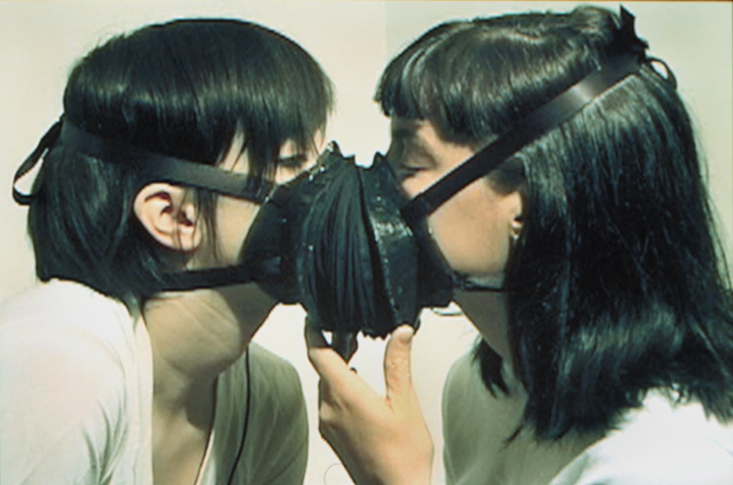 Kissmask. Altered heating duct, fabric, rubber, microphone. Performance detail. 1999.