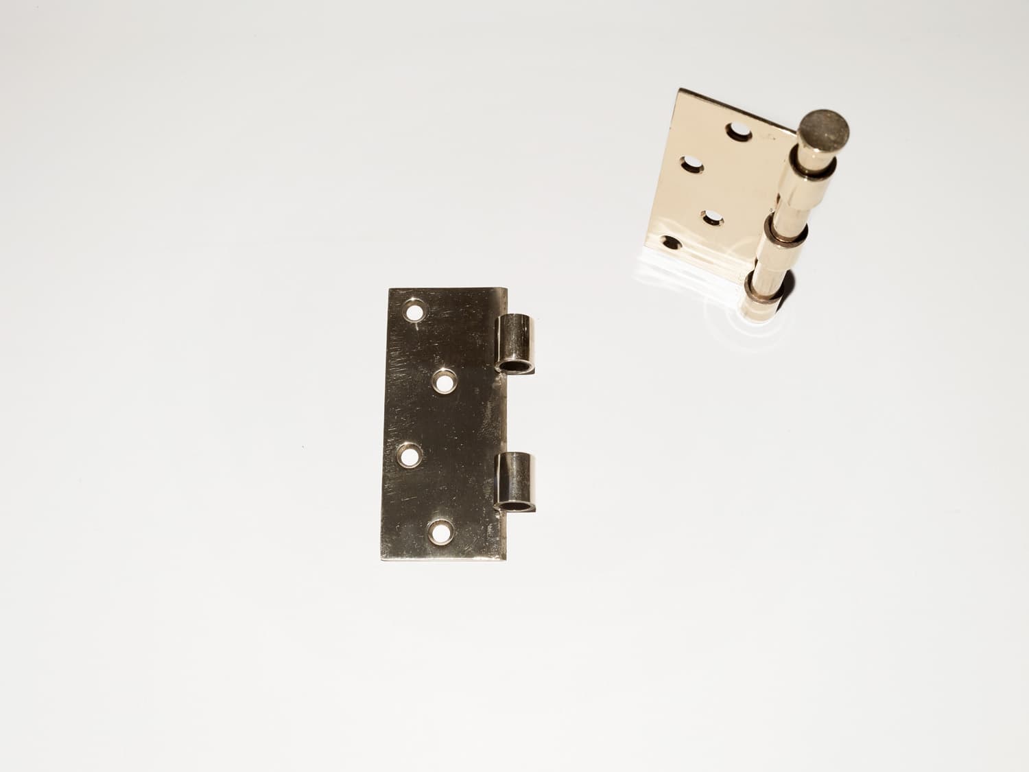 Bearings, 2023, Set of four cast bronze hinges; facsimile of those on Holy Sacrament triptych, 10cm by 3.6cm x 4