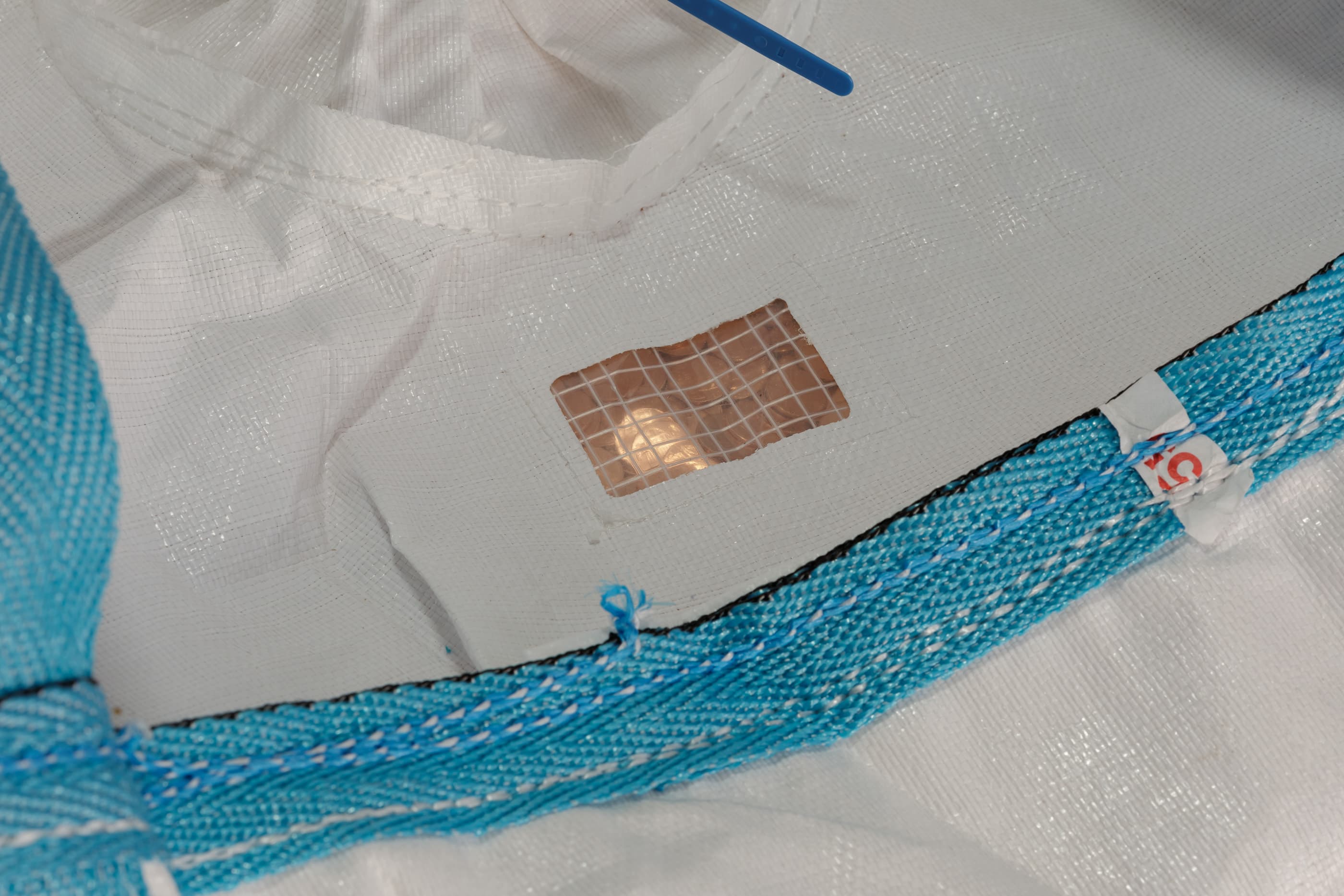 JILL MAGID, 2020 CENTS / U.S. MINT BALLISTIC BAG, $4000 VALUE, PARTIALLY DISPERSED (DETAIL), 2021. PHOTO: USEFUL ART SERVICES.